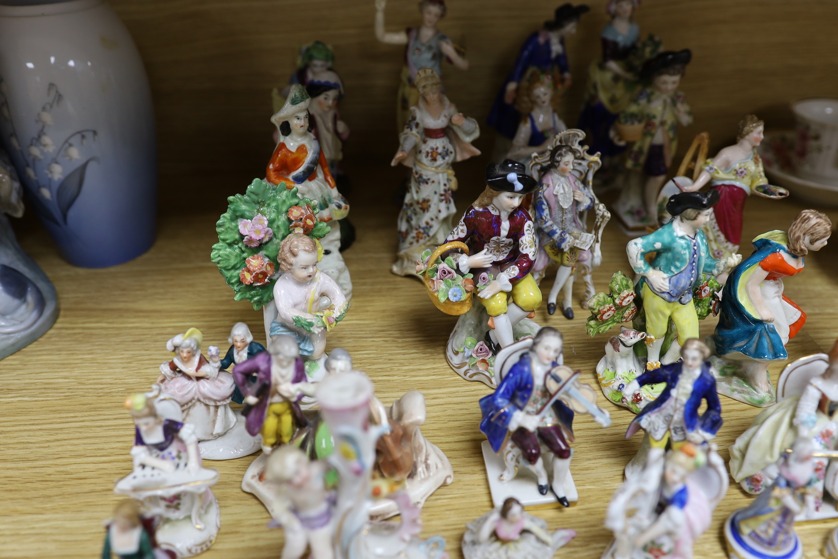 A group of small continental porcelain figures, to include Dresden and others
